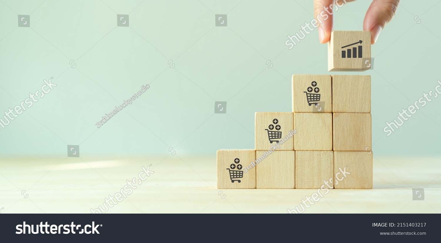 Growth of sales, average order value (AOV) concept. Strategy to get more money per oder. Increase sales in online store, e-commerce. Stacking wooden cubes with sales growth on grey background. #2151403217