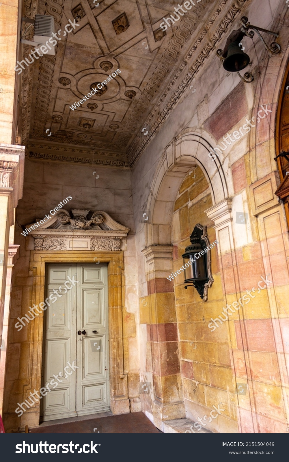 A vertical shot of the hall with adorned walls and a door  Dijon, France  #2151504049