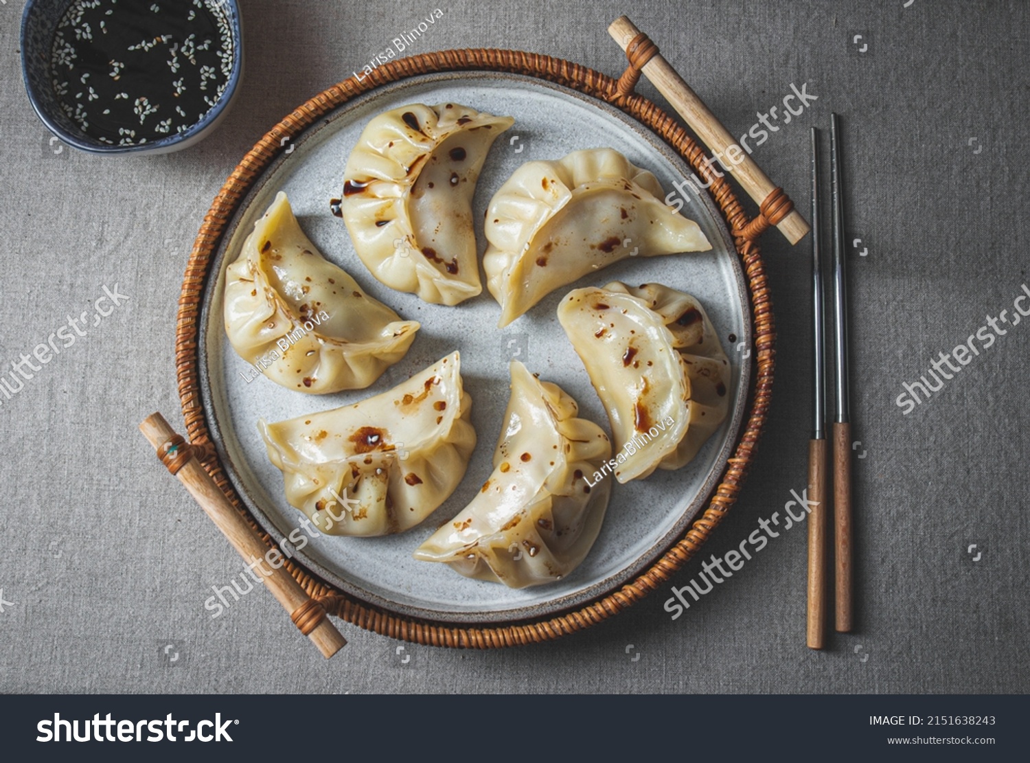 Gyoza Japanese korean dumplings on gray plate on the tabl. Top viewe #2151638243