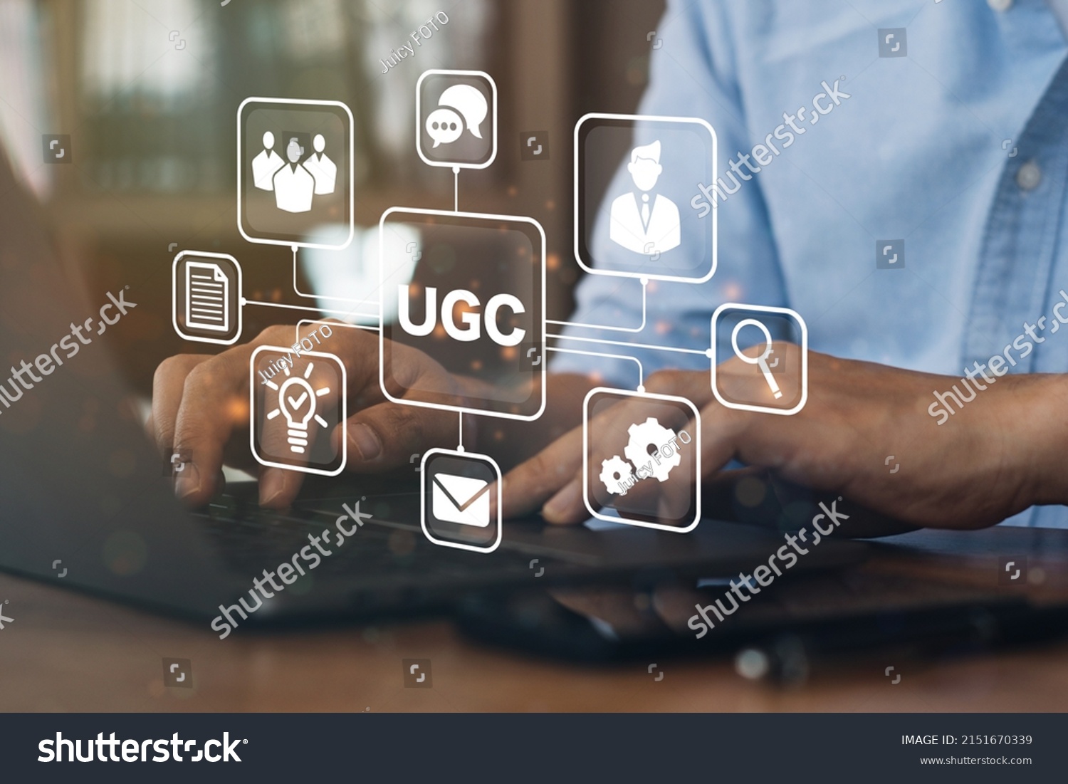 Businessman using a computer to "UGC" abbreviation and icon on laptop computer. User-generated content concept.(UGC) Online marketing concept. Customer create content on social media. #2151670339