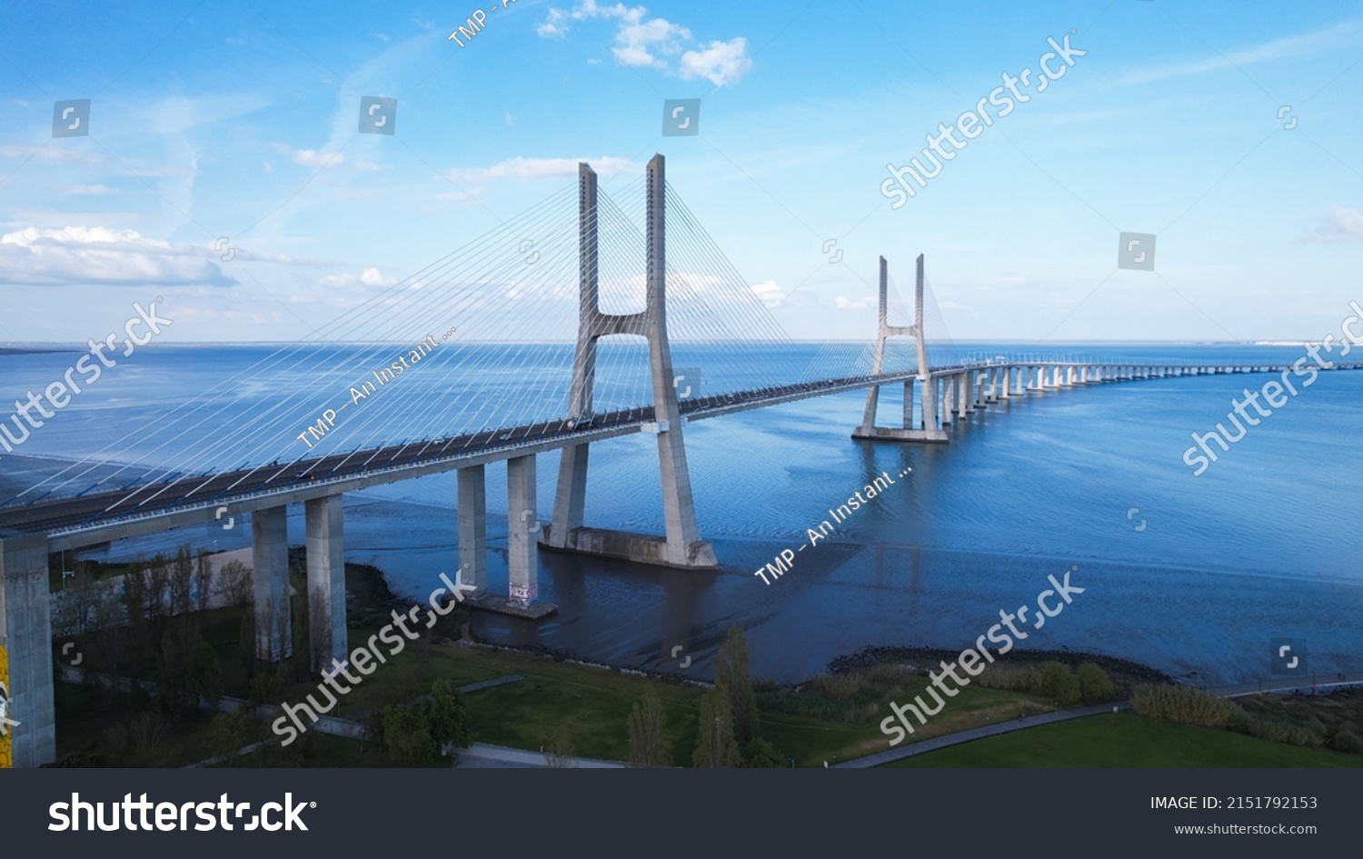 Aerial view of the Vasco da Gama Bridge is a cable-stayed bridge located in the city of Lisbon in Portugal and crosses the Tagus River. It is the second-longest bridge in Europe. #2151792153