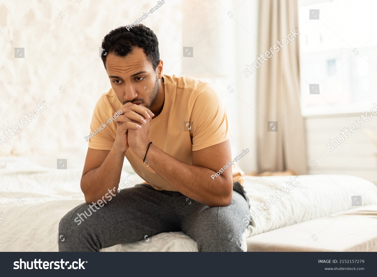 Depressed Middle Eastern Man Suffering From Frustration And Insomnia Sitting Thinking About His Problems In Modern Bedroom At Home. Unhappiness And Stress, Male Depression Concept #2152157279