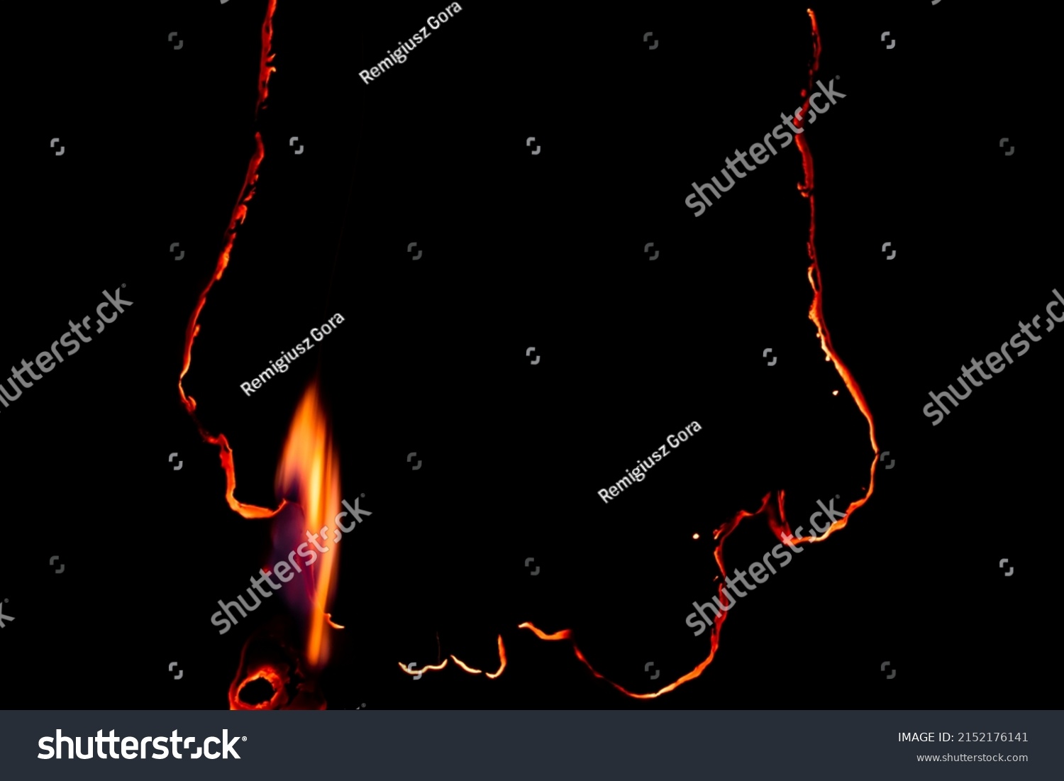 burning paper, glowing edge of paper on a black background #2152176141
