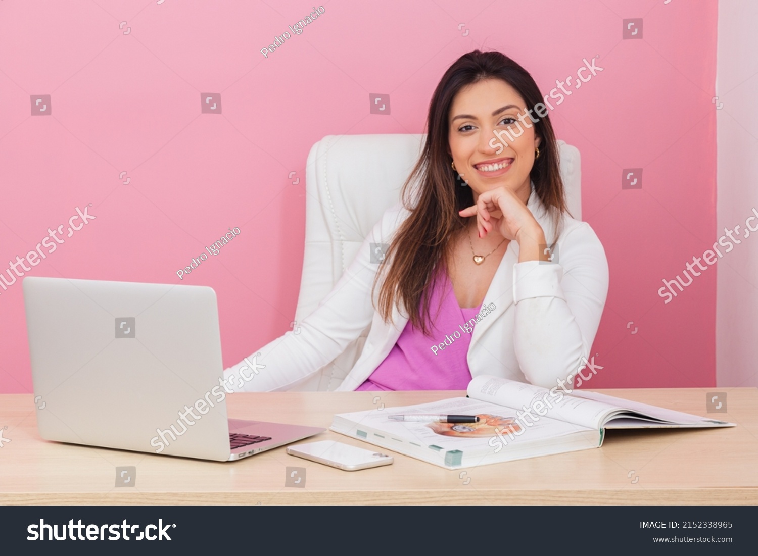 beautician doctor, successful entrepreneur woman, professional portrait, beautician, aesthetic, businesswoman. At a table with a notebook. with hand on chin. smiling. #2152338965