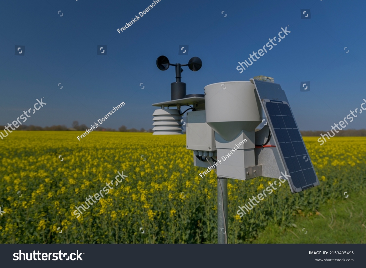 Smart agriculture and smart farm technology. Meteorological instrument used to measure the wind speed and solar cell system in the raps field. Weather station with solar panel placed in the field. #2153405495