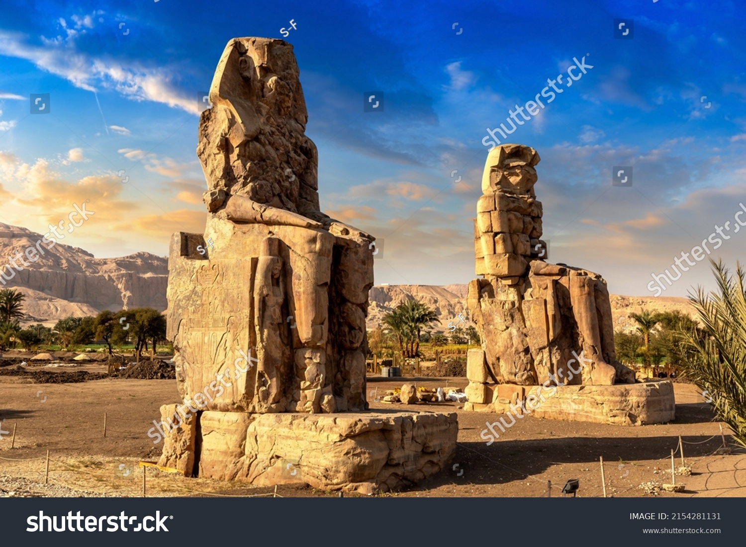 Colossi of Memnon in Luxor, Valley of Kings, Egypt in a sunny day #2154281131