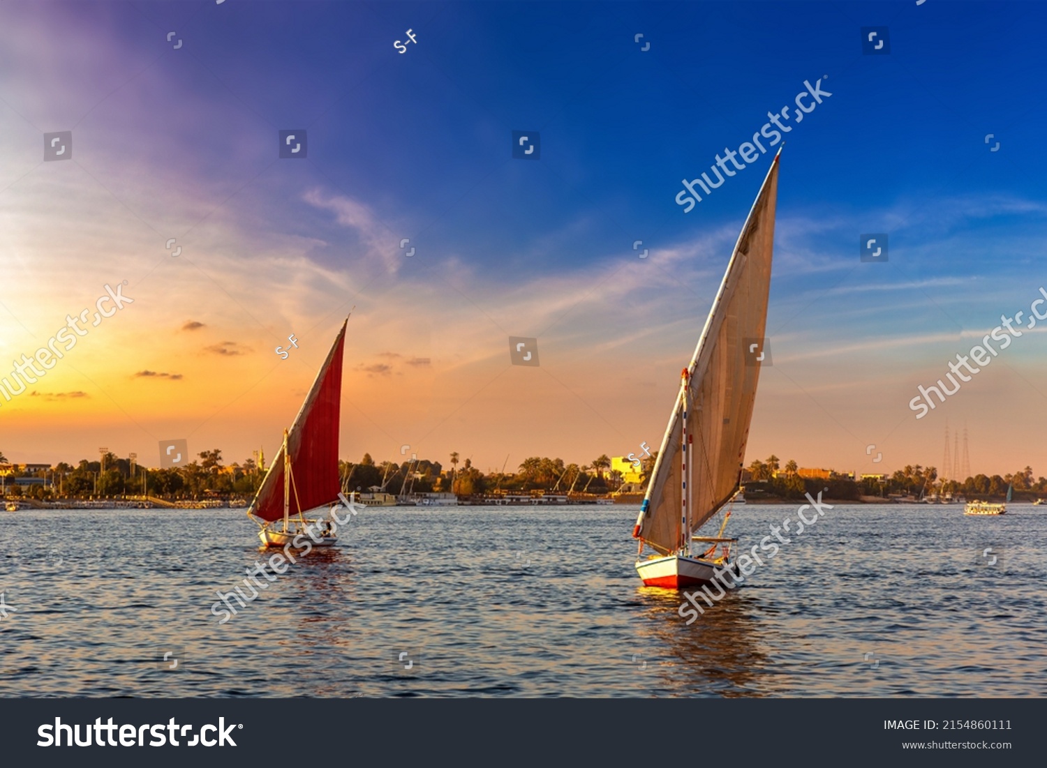 Sailboat on Nile at sunset in a summer evening #2154860111