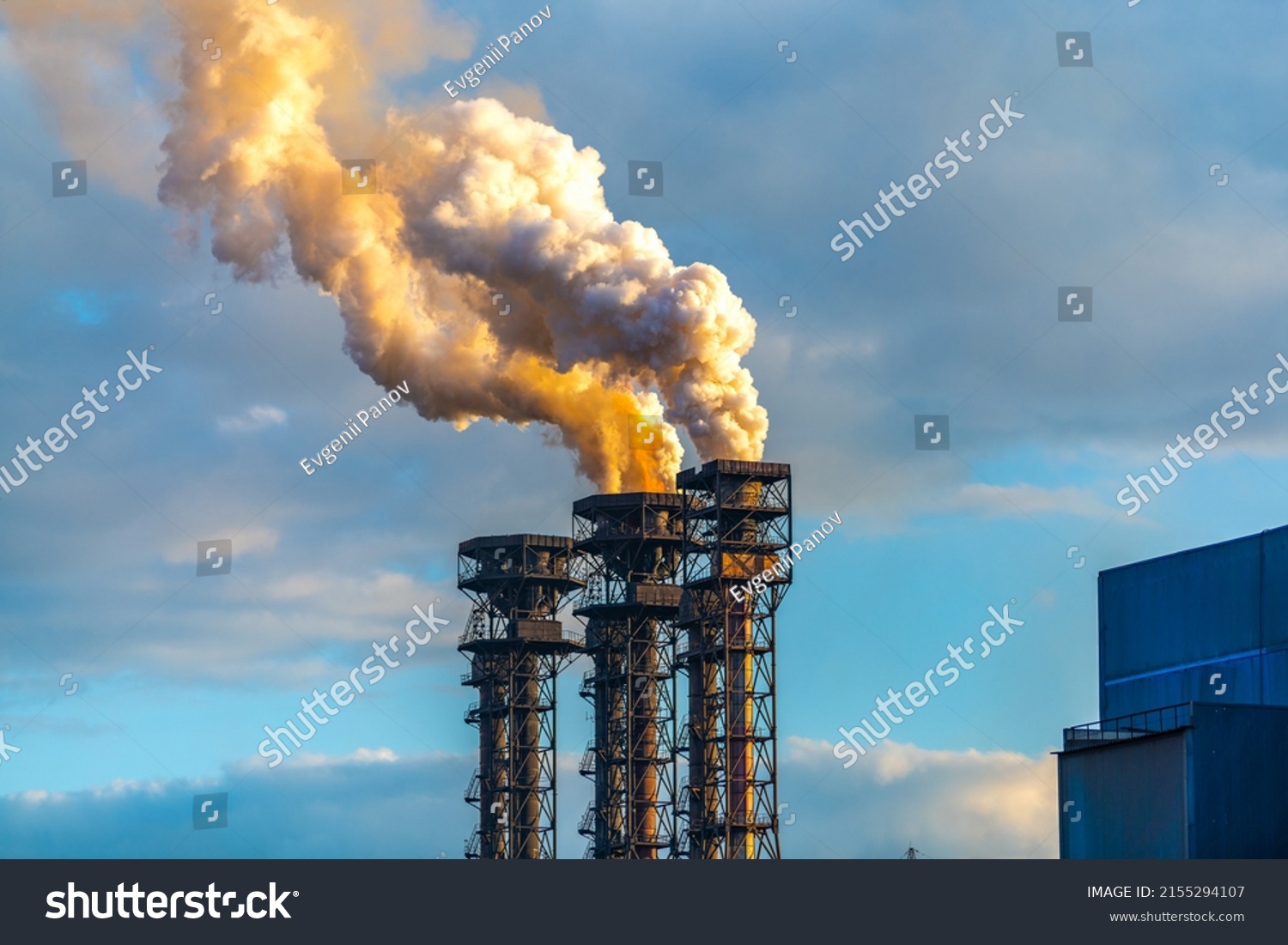 Burning gas torch with thick poisonous smoke. Gas processing and oil refinery. Air pollution! Exhaust gases, ozone depletion, greenhouse effect. 

 #2155294107