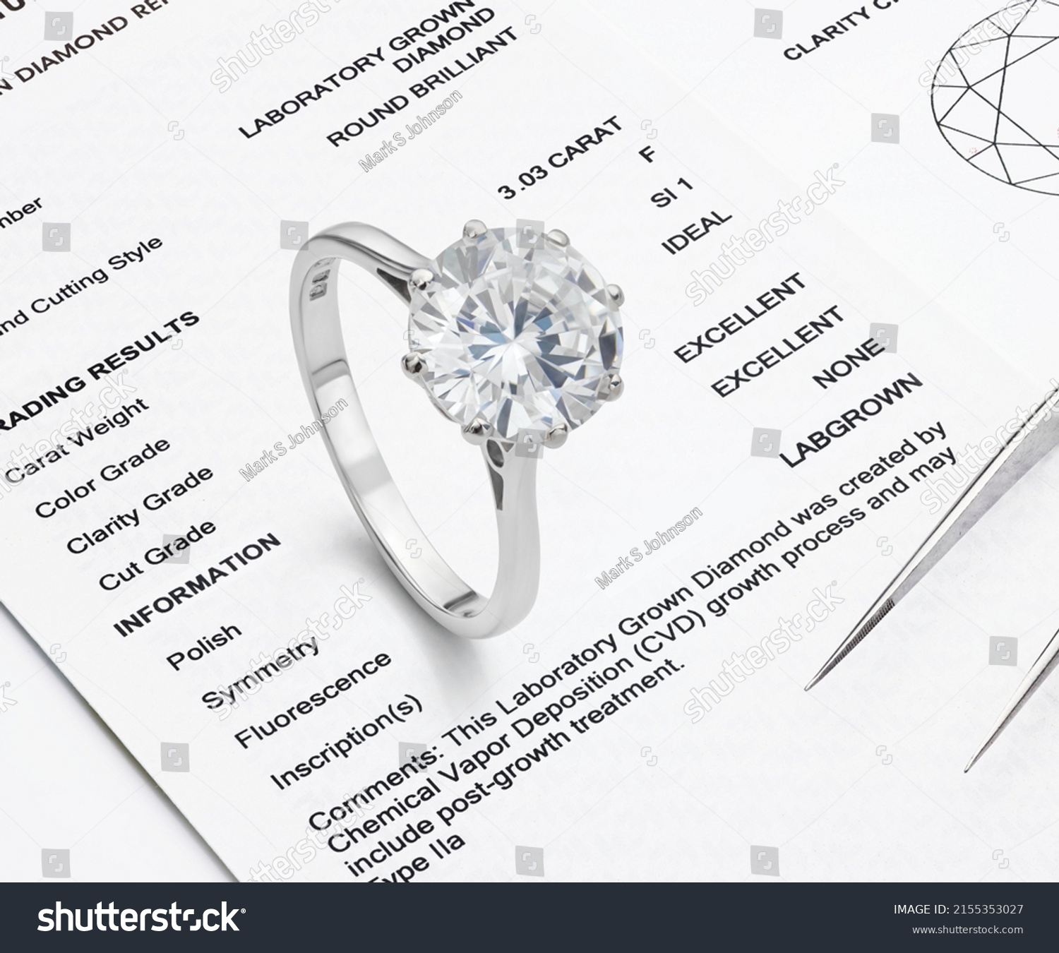 Lab-Created Diamond on Lab Diamond Report Background. Ethical Diamond Photograph. #2155353027
