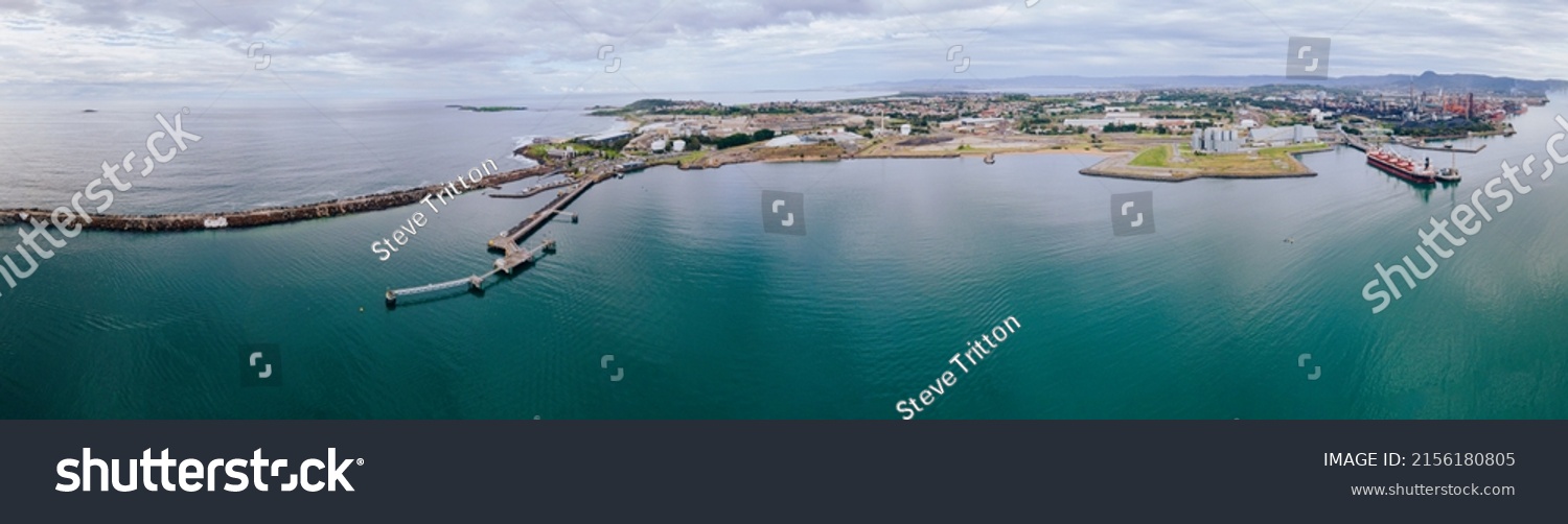 Aerial drone panoramic view of Port Kembla, in the Illawarra Region of NSW, showing the seaport, industrial complex and small harbour foreshore    #2156180805
