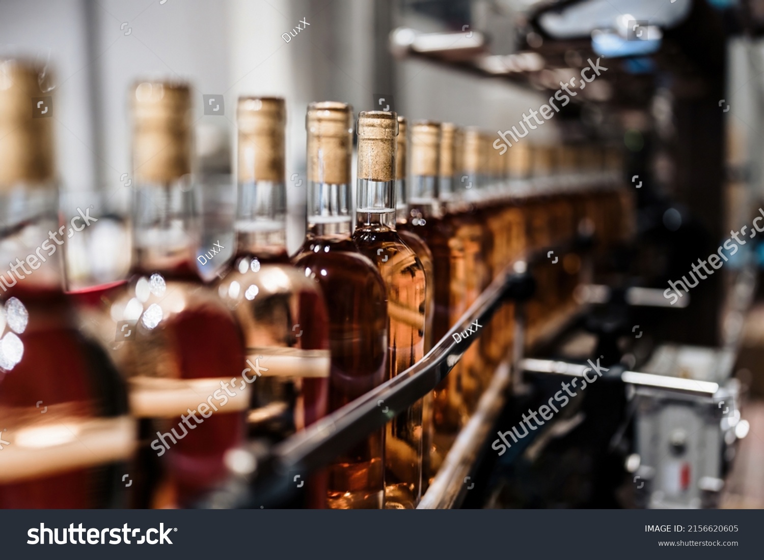 Industrial wine bottling plant theme. Modern industry production line for alcohol drink bottling and packaging.  #2156620605