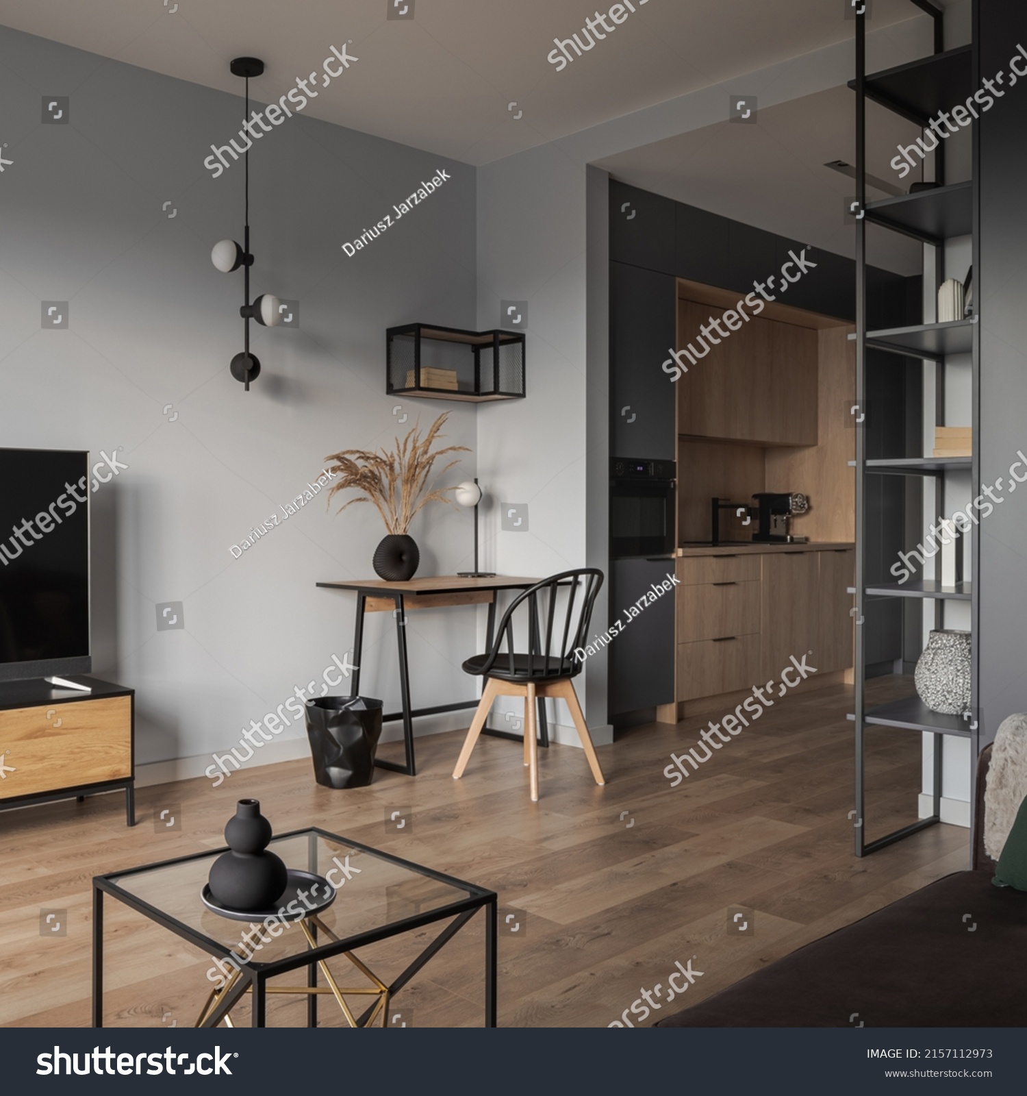 Stylish, open plan studio apartment with home office area in living room and modern, small kitchen #2157112973
