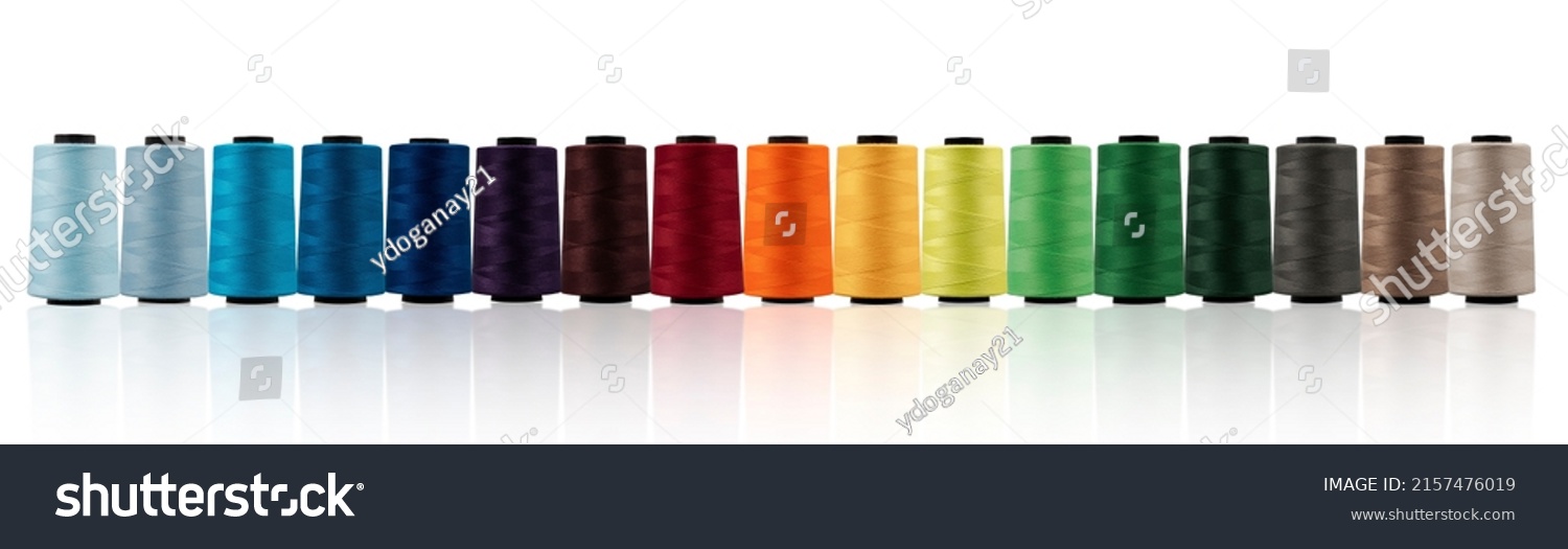 Spool of sewing thread, isolated on white background. Colored yarns used by factories in the clothing industry. Threads wound on the spool. Colored reels	 #2157476019