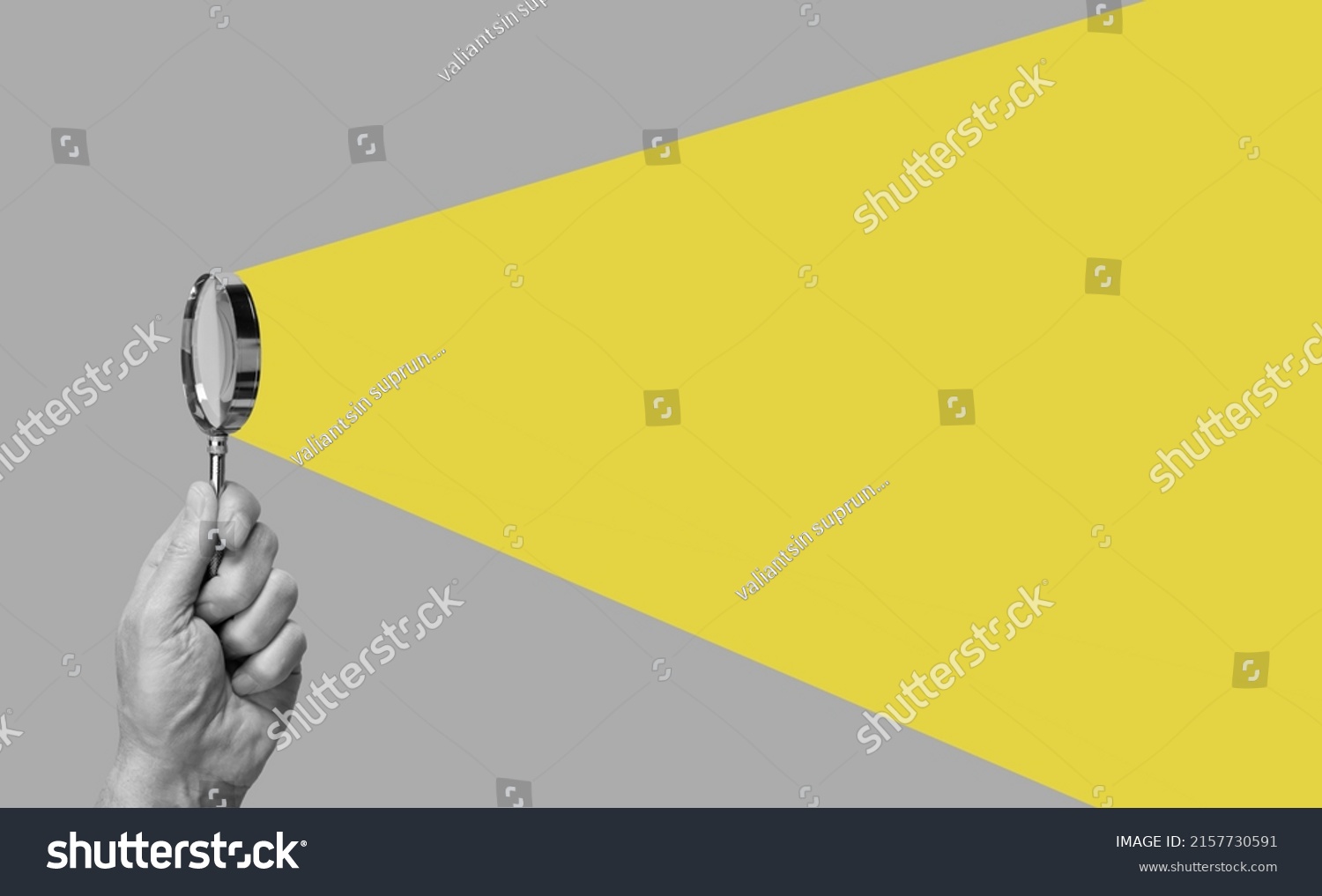 Man hand with magnifying glass. Yellow ray coming from loupe. Conducting check, information search and analysis concept. Spy, accountant, auditor job in abstract style. High quality photo #2157730591