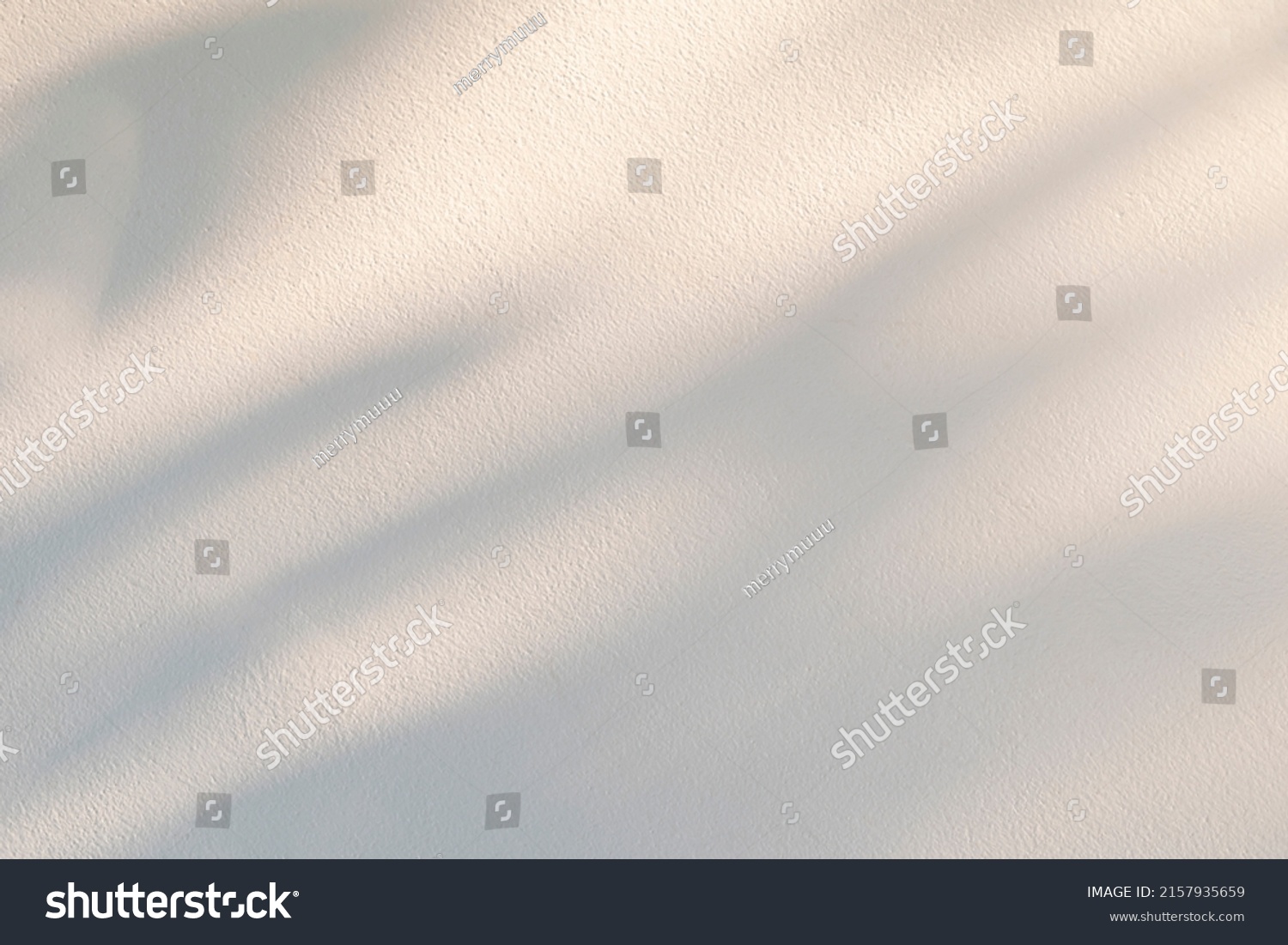 Light and shadow of leaf abstract grey background. Natural shadows and sunshine diagonal refraction on white concrete wall texture. Shadow overlay effect for foliage mockup, banner graphic layout
 #2157935659