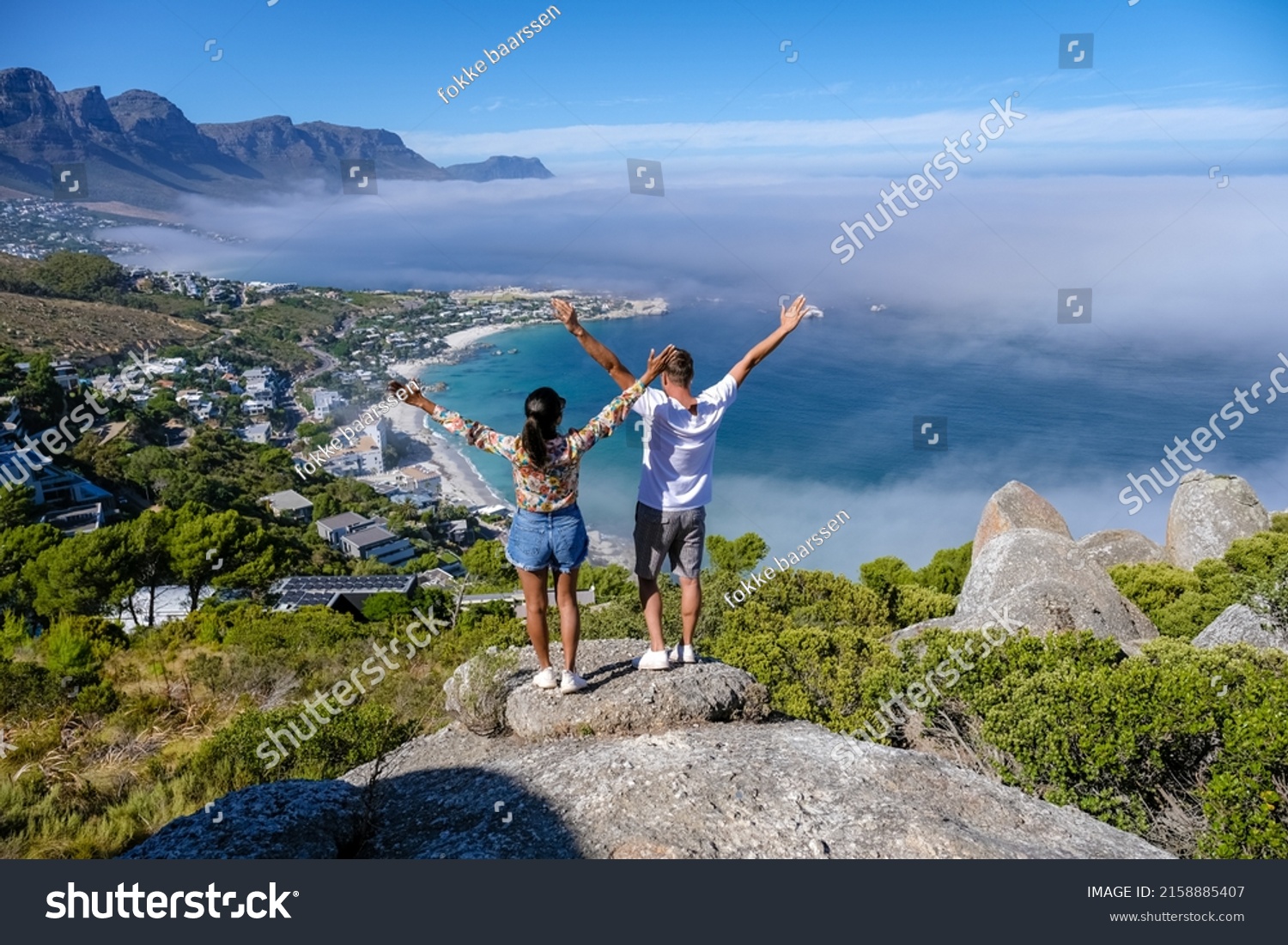 View from The Rock viewpoint in Cape Town over Campsbay, view over Camps Bay with fog over the ocean. fog coming in from the ocean at Camps Bay Cape Town South Africa #2158885407