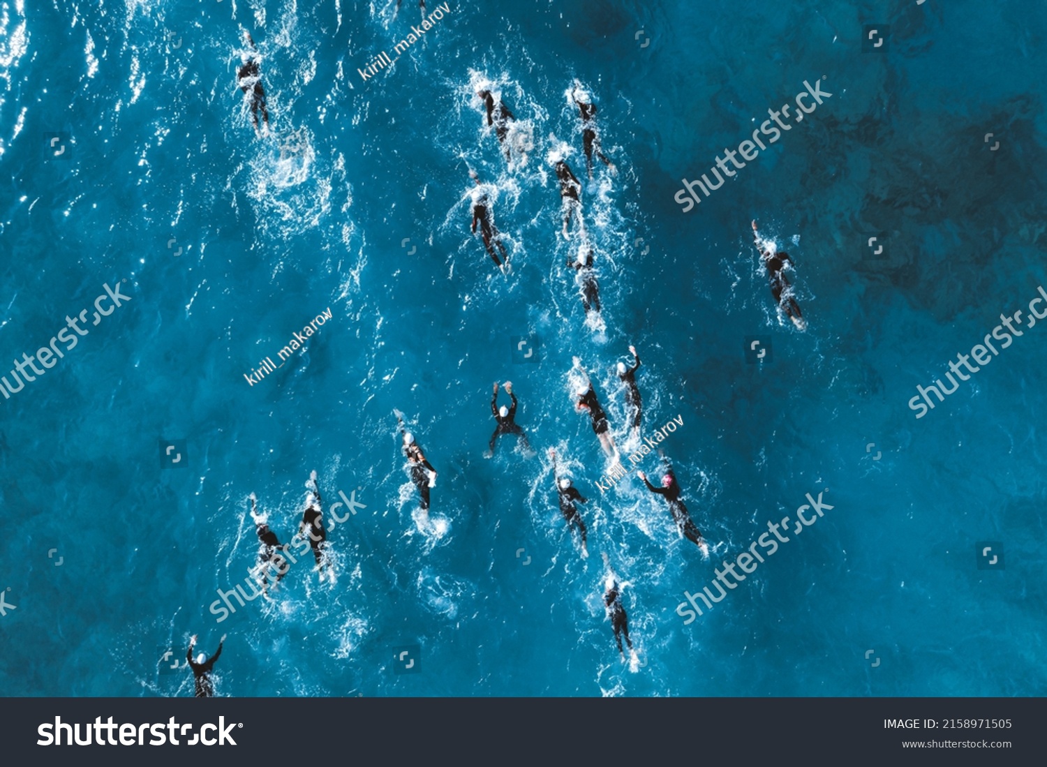 Triathlete swimmers during competition. Overhead view #2158971505