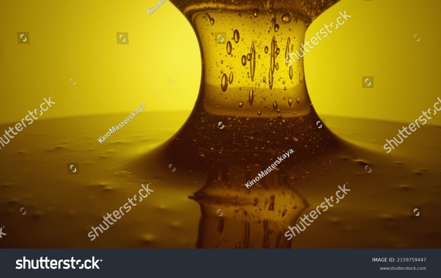 Honey dripping, pouring from spoon. Thick viscous honey molasses dripping. Close up of golden honey liquid, sweet product of beekeeping. Sugar syrup is pouring. Healthy and curative dessert. #2159759447