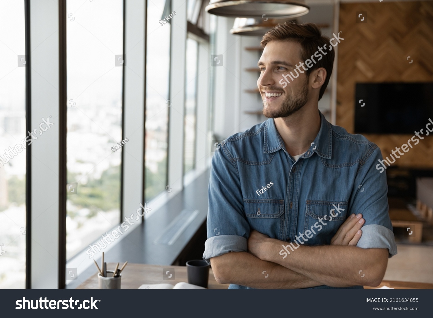 Happy dreaming businessman standing by office or home workplace, looking out of window, thinking of future vision with confidence, smiling at good thoughts, planning investment, enjoying success #2161634855