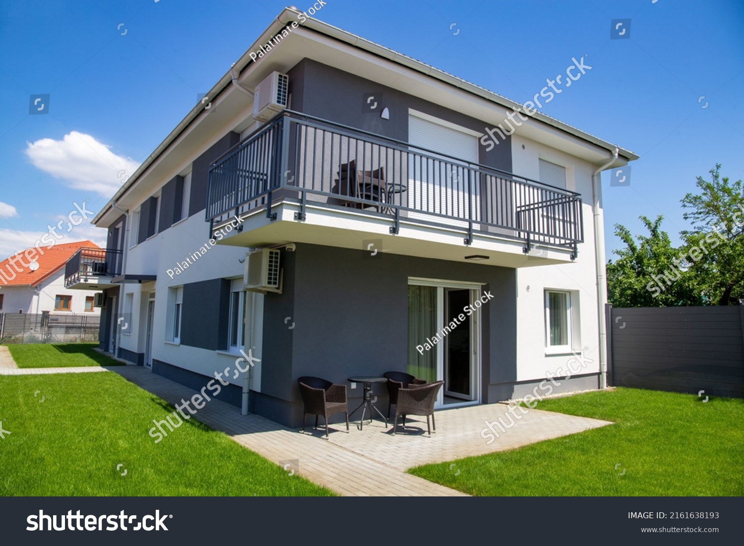 Symbol image single family house: New residential house in front of blue sky #2161638193