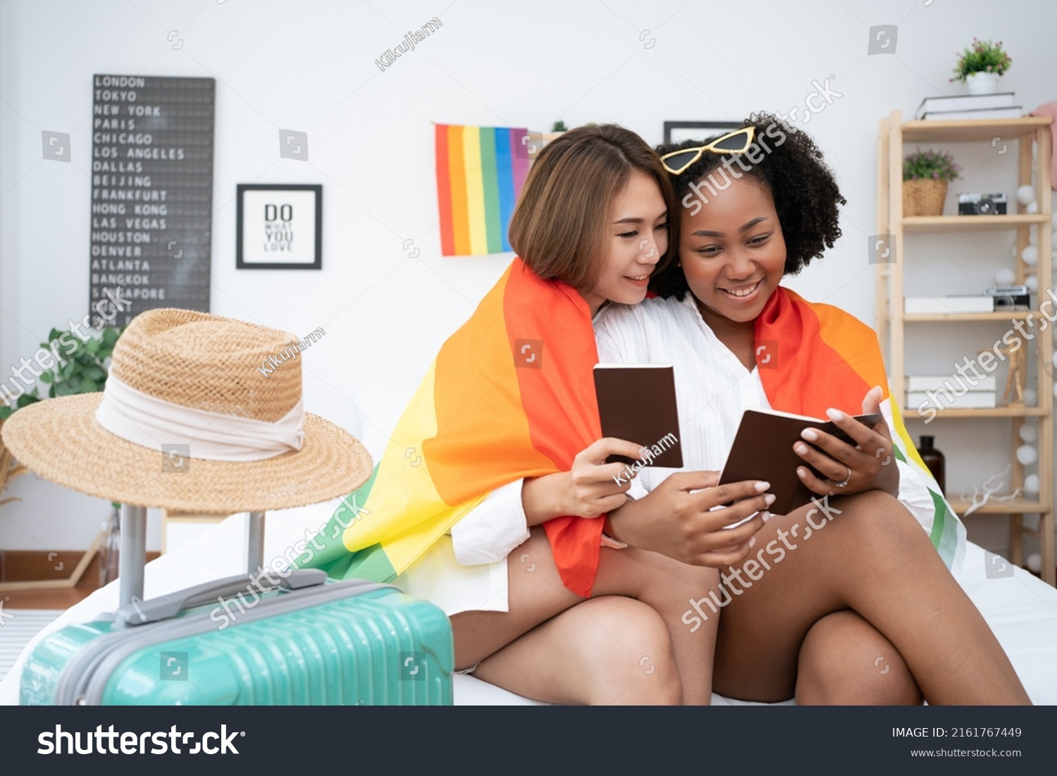 Diversity African American and Asian Married couples Lesbian LGBTQ. Married homosexual show their passports to prepare for a trip together.Sexual equality,LGBT Pride month,Parade celebrations concept. #2161767449