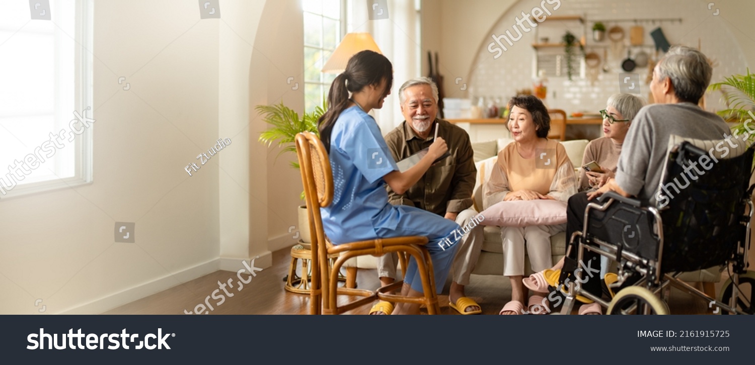 Group of asian senior people listening to young nurse. Psychological support group for elderly and lonely people in a community centre. Group therapy in session sitting in a circle in a nursing home. #2161915725
