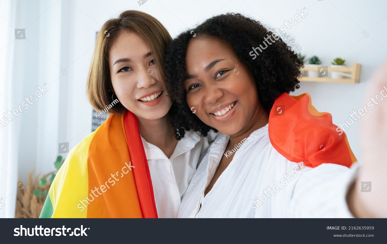 Diversity African American and Asian Married couples Lesbian LGBTQ. Married homosexual show Diamond ring.Sexual equality,LGBT Pride month,Parade celebrations concept.Family of happiness smiling. #2162635959