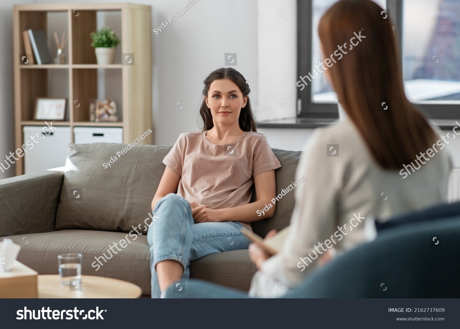 psychology, mental health and people concept - young woman patient and woman psychologist at psychotherapy session #2162737609