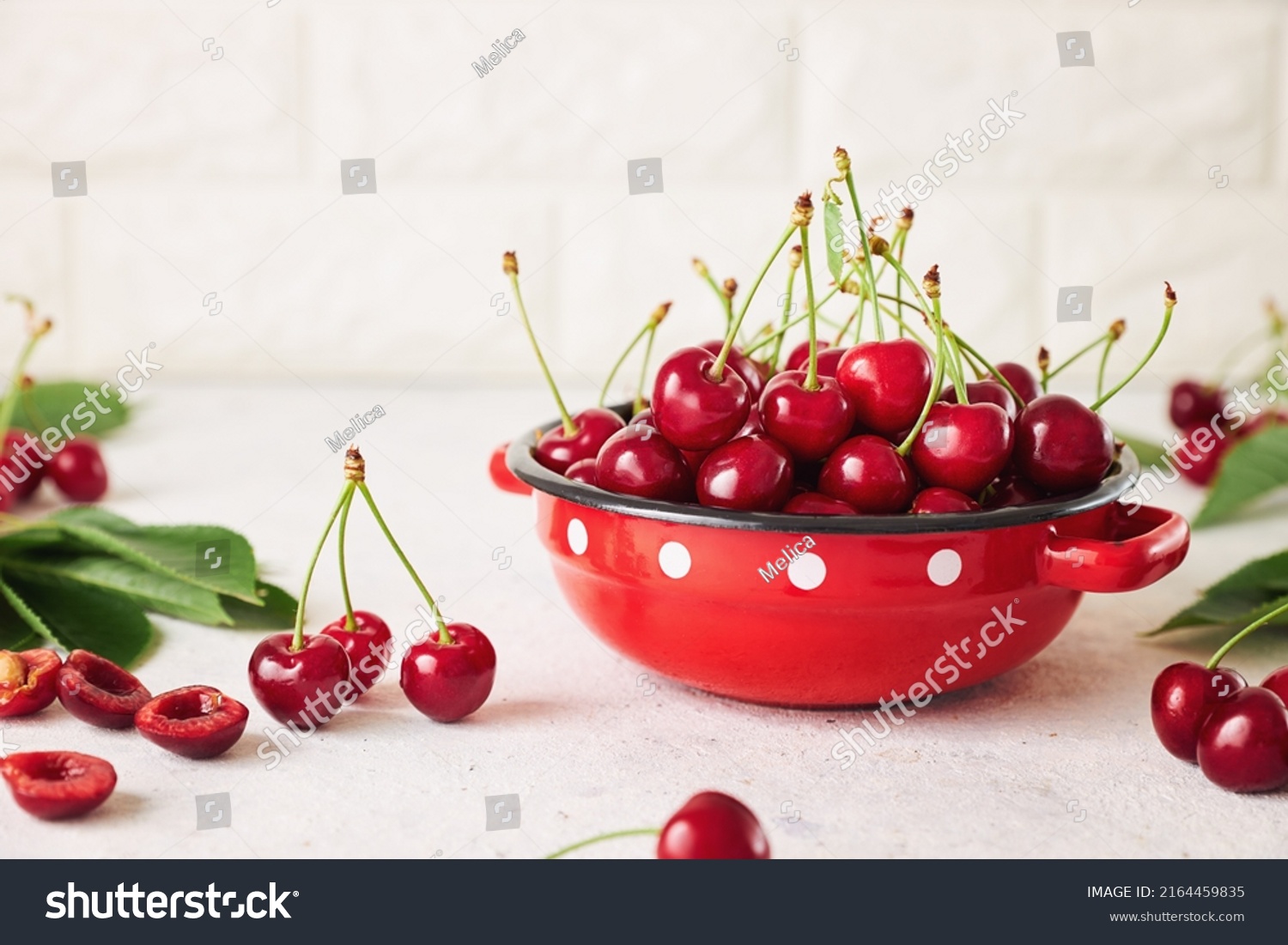 Freshly harvested cherries in a bowl. Fresh sweet organic cherries in a red bowl. #2164459835