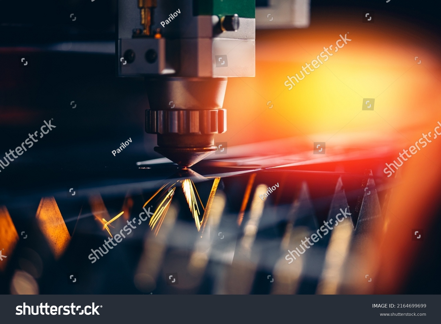 Industrial Macro CNC laser machine cutting sheet metal with light spark. #2164699699