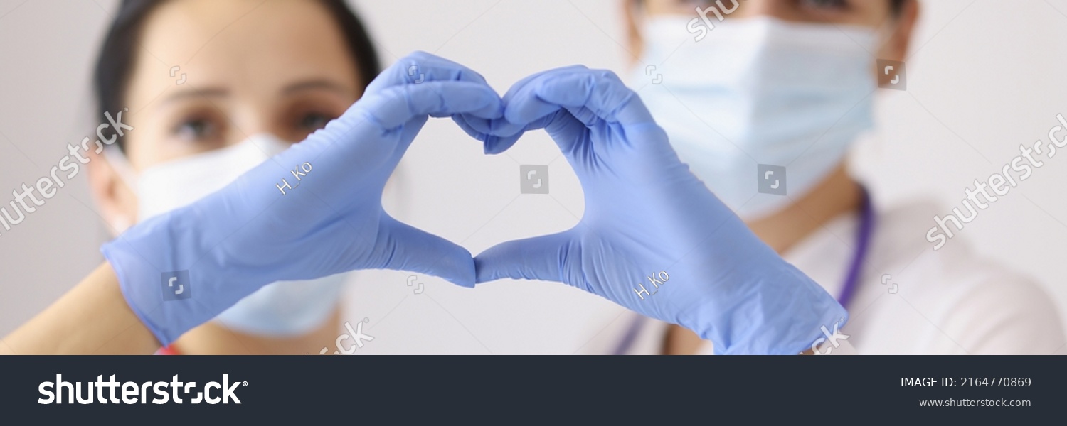 Physicians forming heart with hands #2164770869