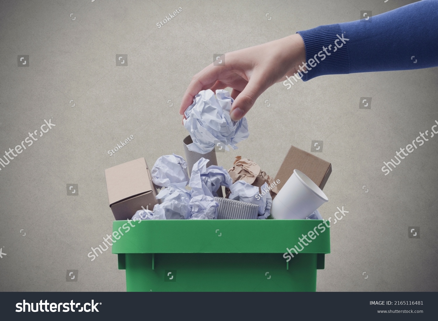 Woman putting paper in the waste bin, separate waste collection and recycling concept #2165116481