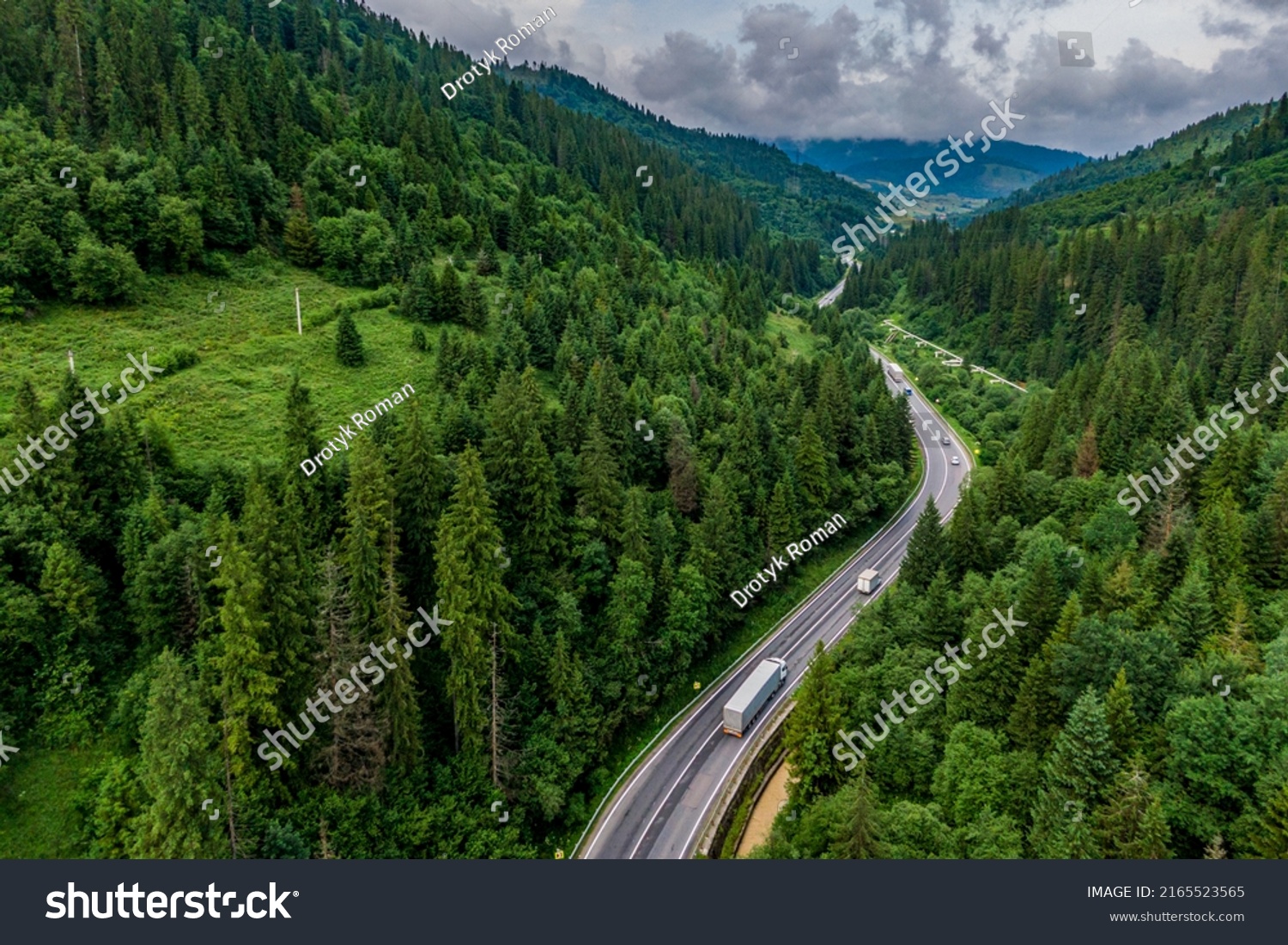 cargo truck on the higthway. cargo delivery driving on asphalt road through the mountains. seen from the air. Aerial view landscape. drone photography.  #2165523565