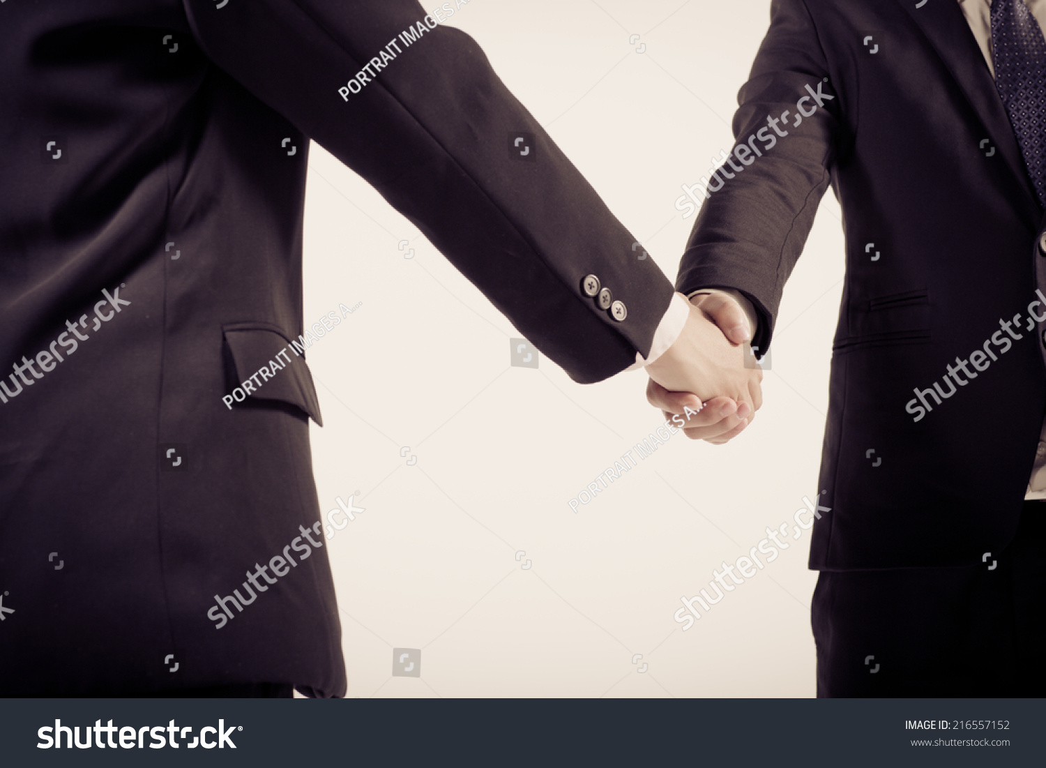 Two business people shaking hands. Isolated on white background. #216557152