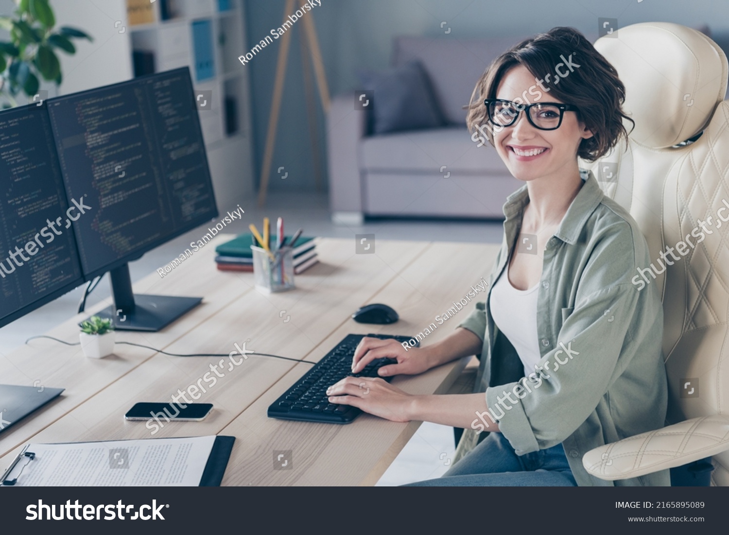 Photo of pretty smiling student girl practicing developing website young system administrator working in office #2165895089