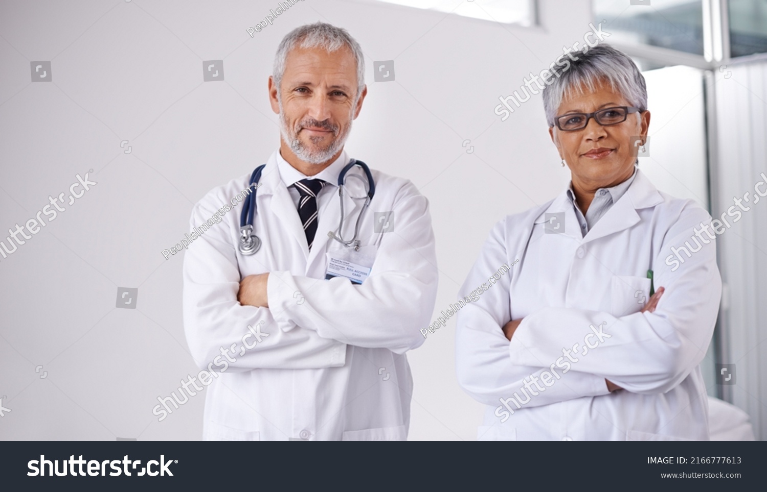 Consulting a colleague for a second opinion. Shot of two doctors working together in a hospital. #2166777613