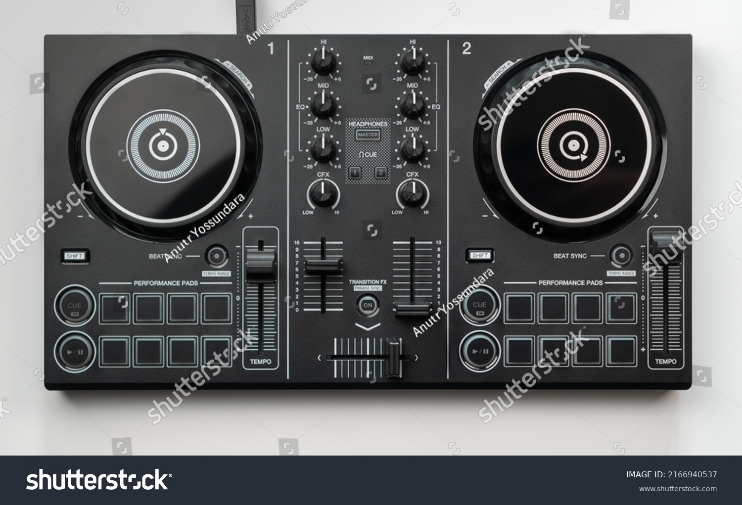 DJ mixing deck Controller connecting to Laptop and tablet using USB cable top view, isolated on white. #2166940537