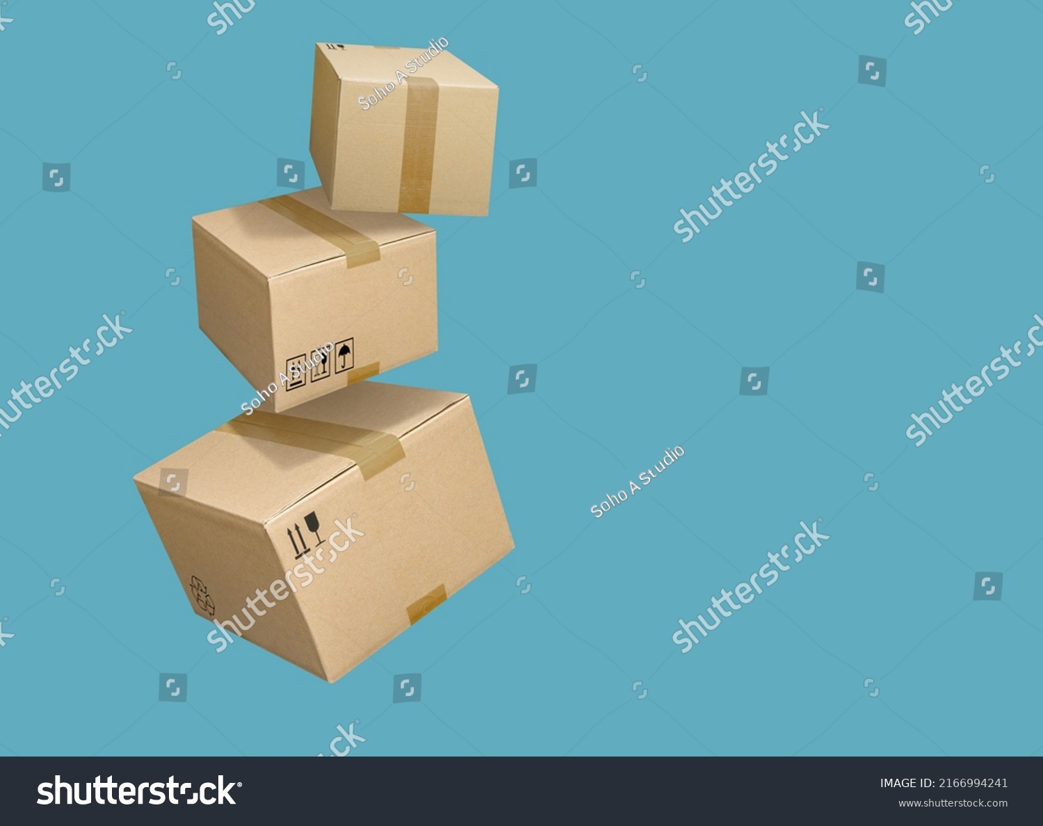 Closed and taped cardboard boxes flying isolated on turquoise blue background #2166994241