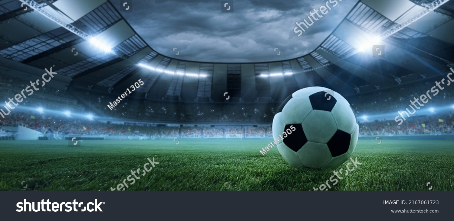 After game. Closeup soccer ball on grass of football field at crowded stadium with spotlights at evening time. Concept of sport, art, energy, power. Poster for ad, design #2167061723
