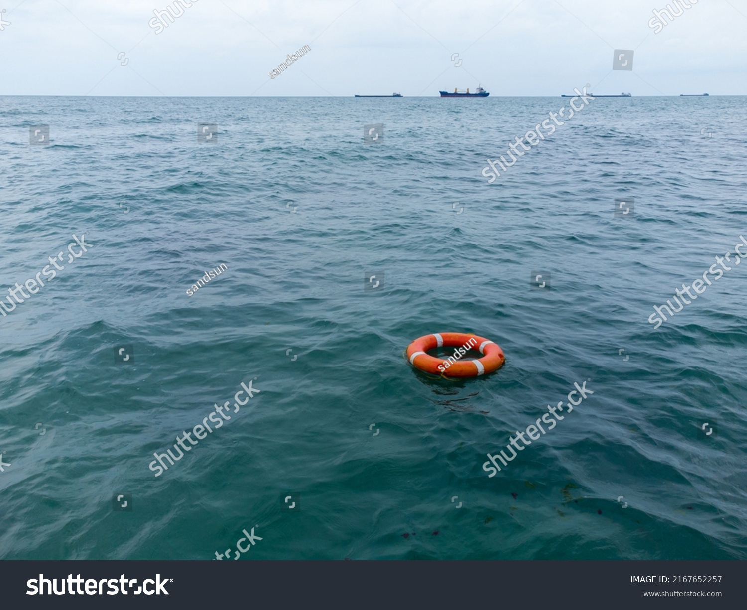 Aerial view of lifebuoy in the sea. Life ring floating in a sea. #2167652257