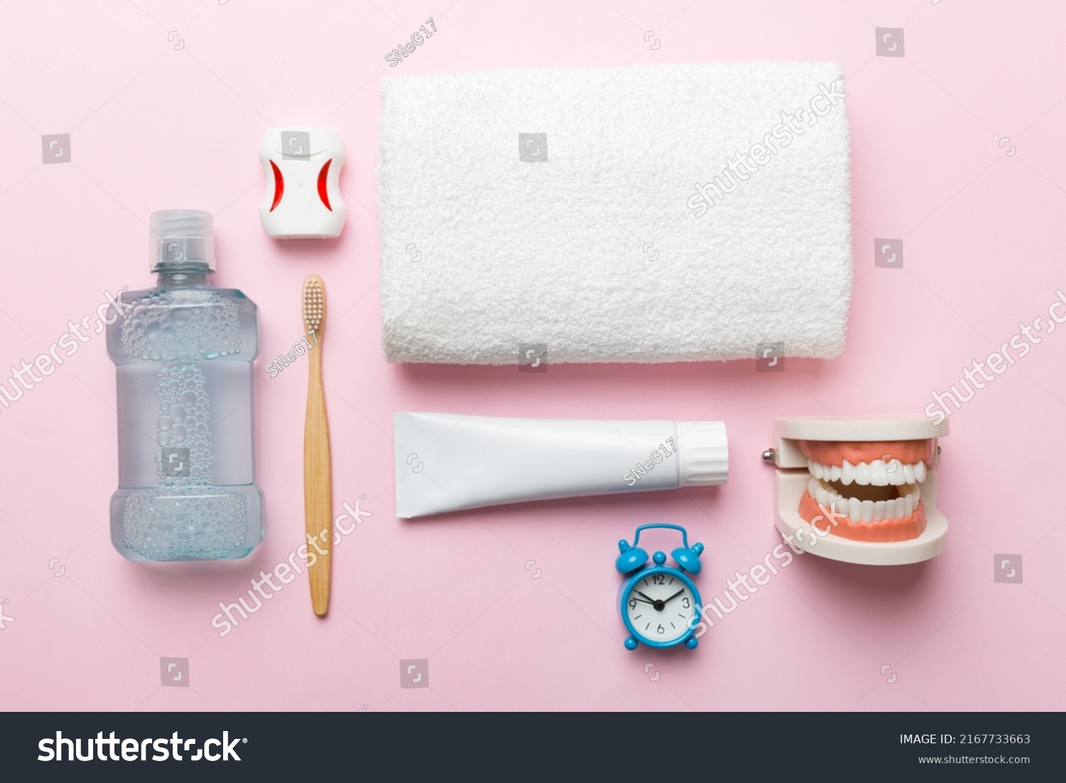 Mouthwash and other oral hygiene products on colored table top view with copy space. Flat lay. Dental hygiene. Oral care kit. Dentist concept. #2167733663
