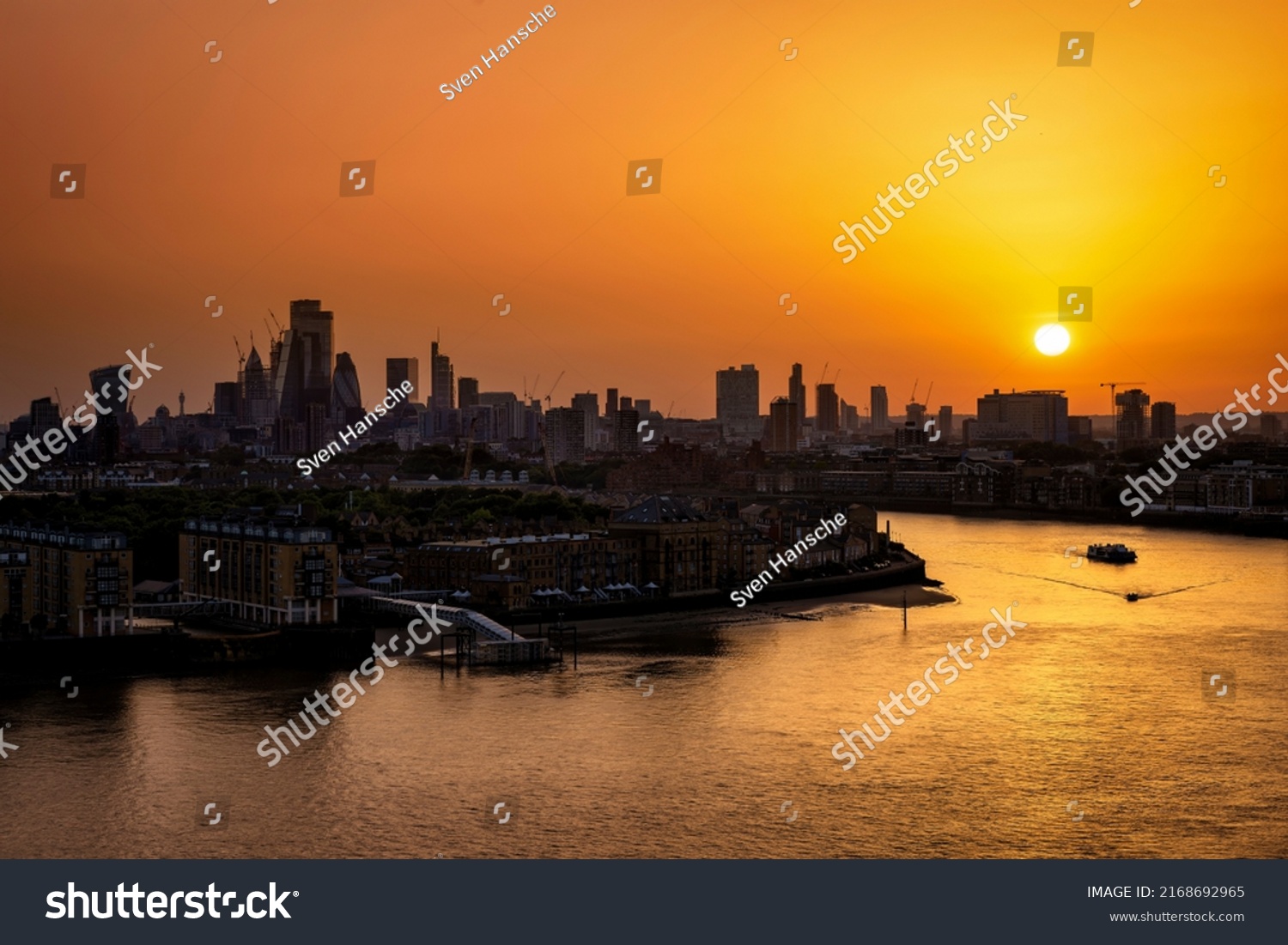 Panorama of the London skyline with river Thames during a fiery summer sunset, England #2168692965