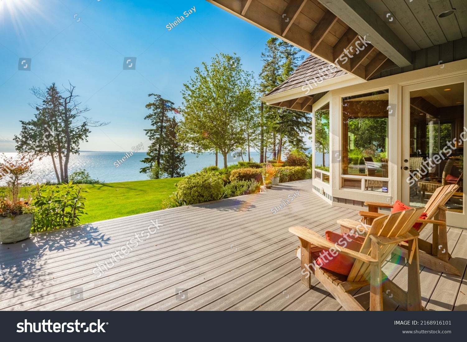 Stately waterfront home in pacific northwest with ocean views expansive decks hot tub front porch and long paved driveway #2168916101