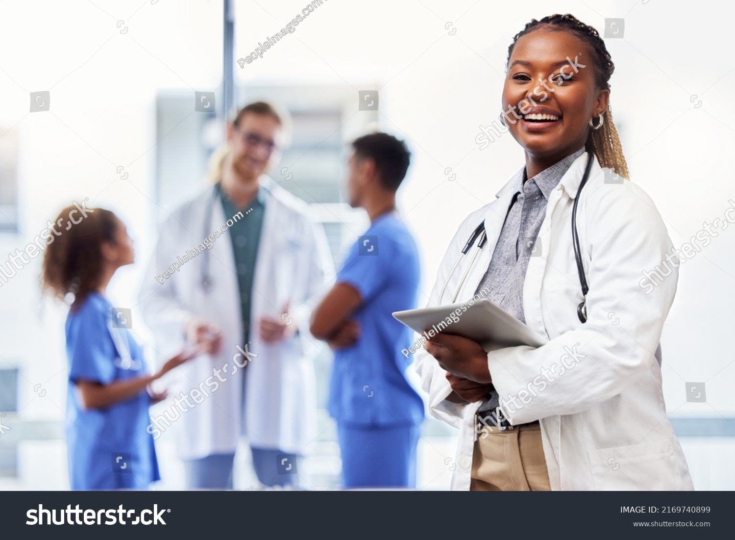 She was made for the medical field. Shot of a young female doctor using a digital tablet at work. #2169740899