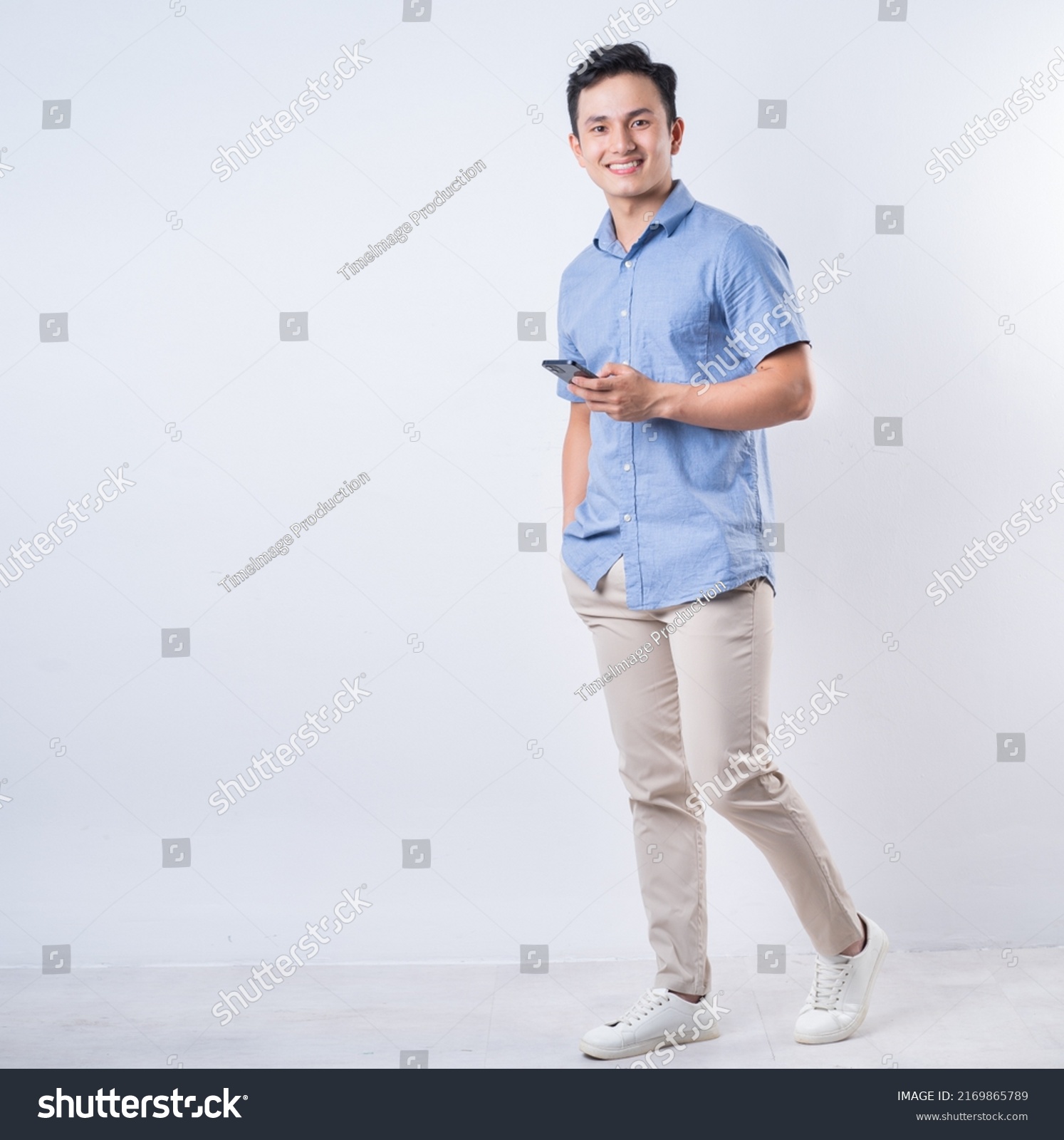 Full length image of young Asian man on white background #2169865789