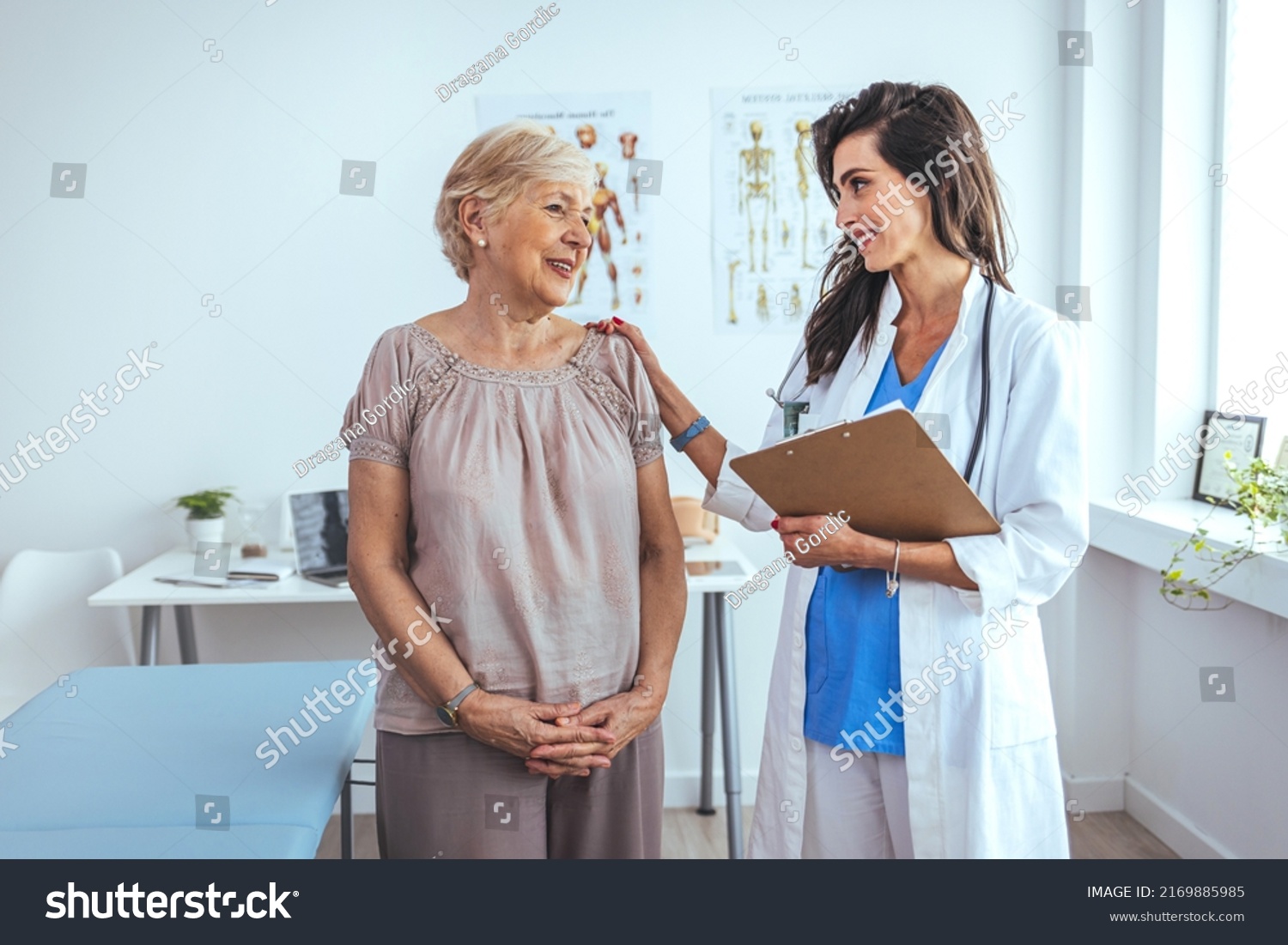 Portrait of female doctor explaining diagnosis to her patient. Female Doctor Meeting With Patient In Exam Room. Cropped shot of a medical practitioner reassuring a patient #2169885985