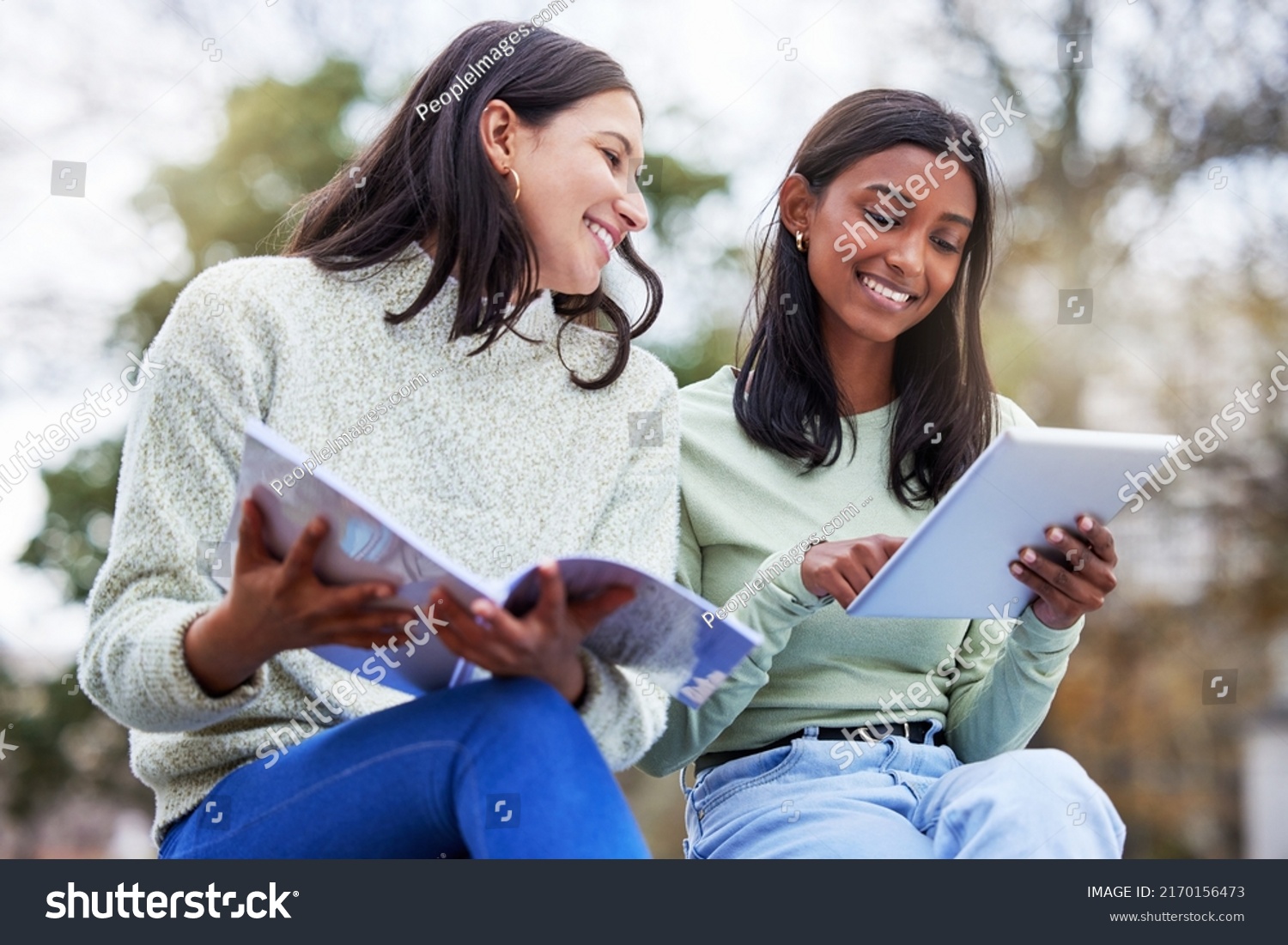 Theres nobody like a study buddy. Shot of two young women studying together at college. #2170156473