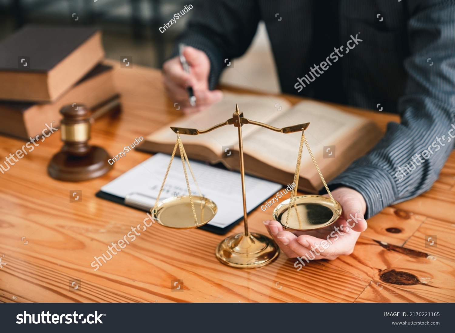 Attorney reading law code, studying constitution to protect human rights closeup, Male lawyer or judge working with Law books, gavel #2170221165