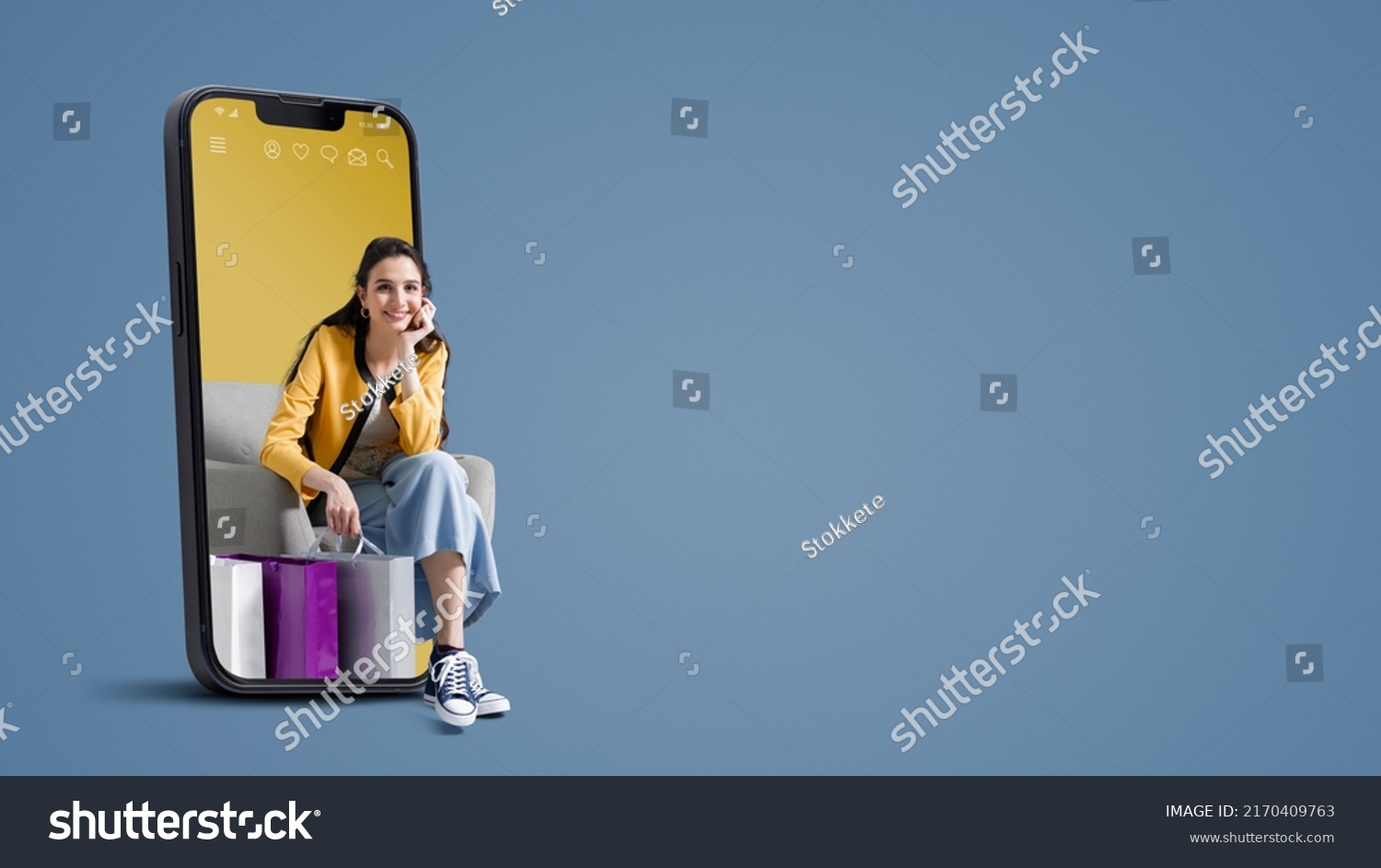 Happy young woman with shopping bags in a smartphone, online shopping and sales concept, blank copy space #2170409763