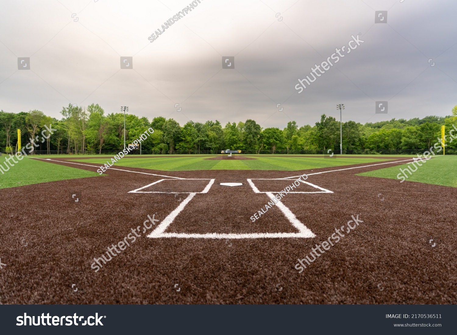 View of  high school synthetic turf baseball field looking from batters box toward the outfield. #2170536511
